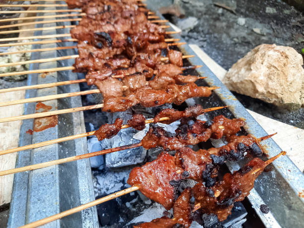 istock Cooking Grilled Barbecue Beef Satay (Sate Daging Sapi) On Charcoal Grill Stove 1580339931
