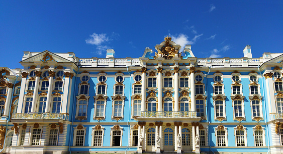 Beautiful building exterior outside against blue sky. Pushkin town, Saint-Petersburg, Russia. July 13, 2022.