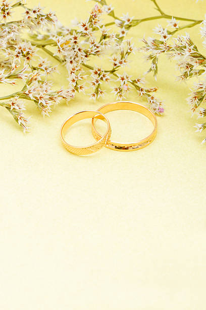 istock Gold wedding rings and branch flowers 158036505