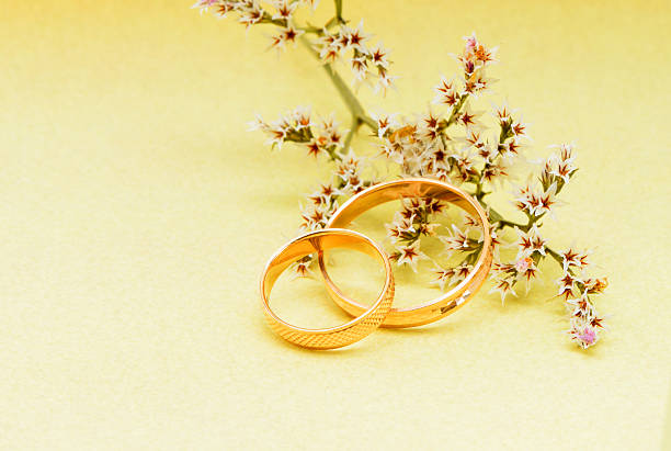 istock Gold wedding rings and branch flowers 158036525