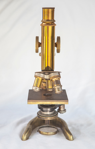 1920 microscope. Isolated over white fabric