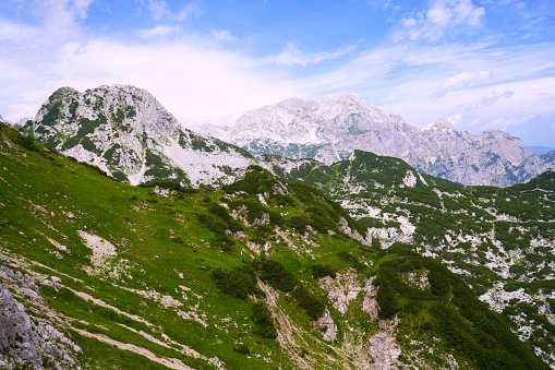 The view from the 2050 meter high Visevnik peak to the surrounding mountains. It is most visited 2000 and up mountain peak, starting from Plateau Pokljuka as it has good markings, easy path and it can be reached in two ours. The Karst Plateau is located in the Julian Alps at an elevation up to 1400 meters in northwestern Slovenia.