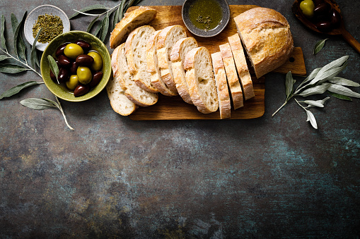 Ciabatta bread sliced on a board, background, copy space, top view