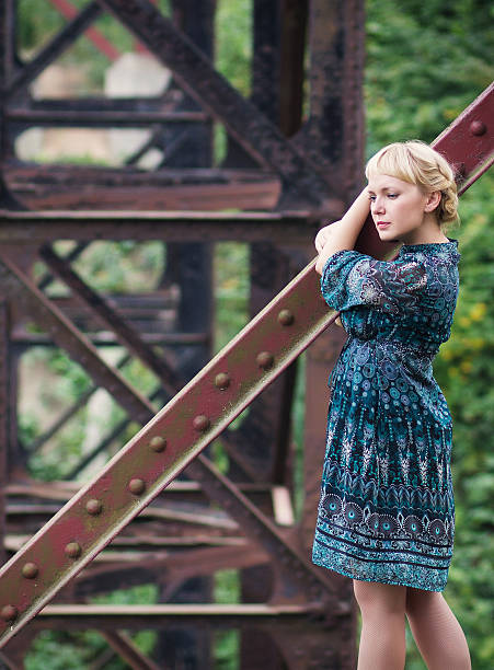 istock young girl standing on bridge bearing 158045843