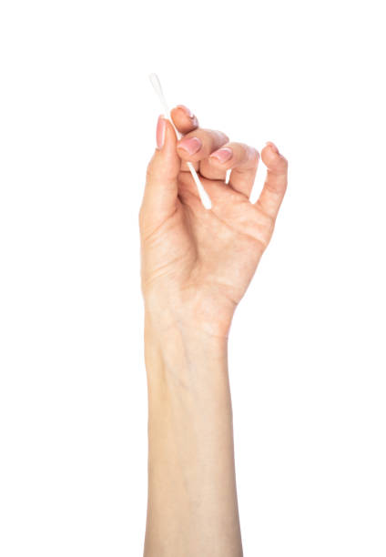istock Cotton sticks in hands isolated on the white background. Cotton buds isolated. 1580486873