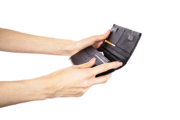 istock Black modern women's leather wallet in hand isolated on white background. 1580491674
