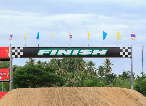 starting point and the end point of victory in a motocross course is a dangerous stunt in a small, small country racetrack.