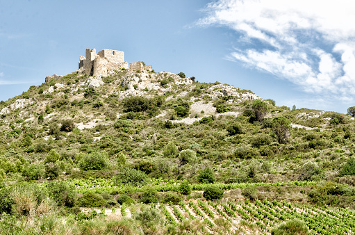 This photograph was taken on June 16, 2023 in the Cathar country (France). On the way to Maury, this place, Quéribus, is one of the emblematic places of the Cathar Country. A vertiginous citadel, its strategic position on a rocky outcrop made it possible to monitor the border with Aragon. With its impressive panorama, this site is a must-see.