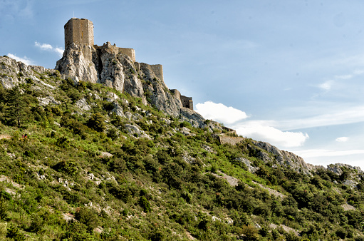 This photograph was taken on June 16, 2023 in the Cathar country (France). On the way to Maury, this place, Quéribus, is one of the emblematic places of the Cathar Country. A vertiginous citadel, its strategic position on a rocky outcrop made it possible to monitor the border with Aragon. With its impressive panorama, this site is a must-see.