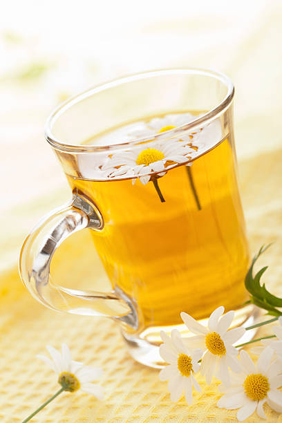 istock cup of herbal tea with chamomile flowers 158050281