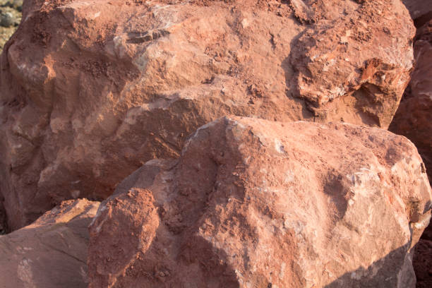istock Brown mountain sandstone with large chunks of patterns, designed to be like nature by heavy machinery, beautifully crafted in a vast lakeside garden, perfect for relaxing and watching nature in summer 1580521075
