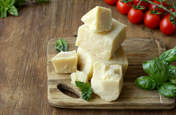 istock hard parmesan cheese block on wooden board 1580557820