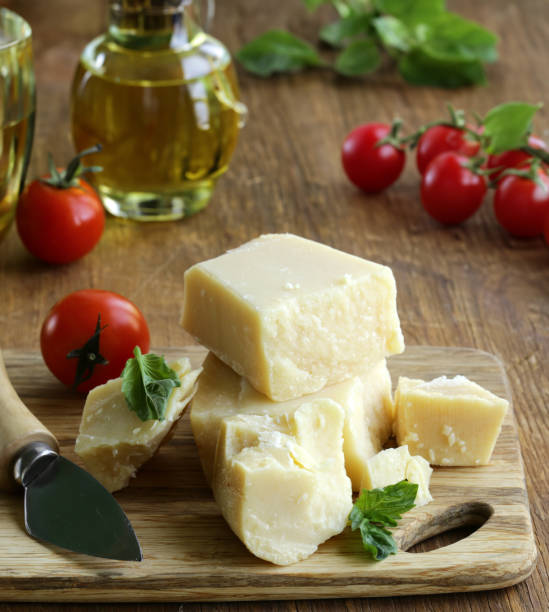istock hard parmesan cheese block on wooden board 1580558344