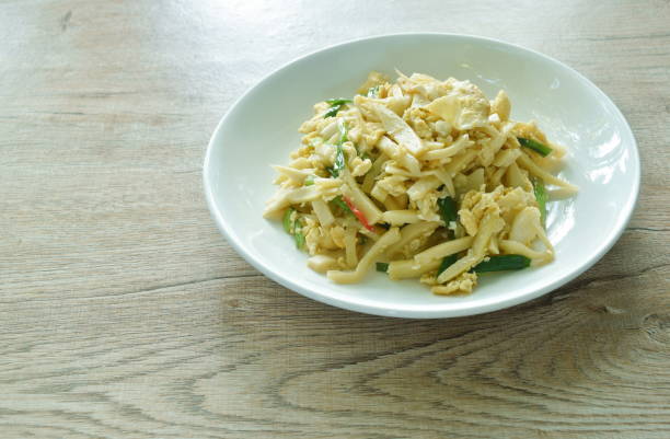 istock spicy stir fried bamboo shoot and egg with spring onion 1580566892