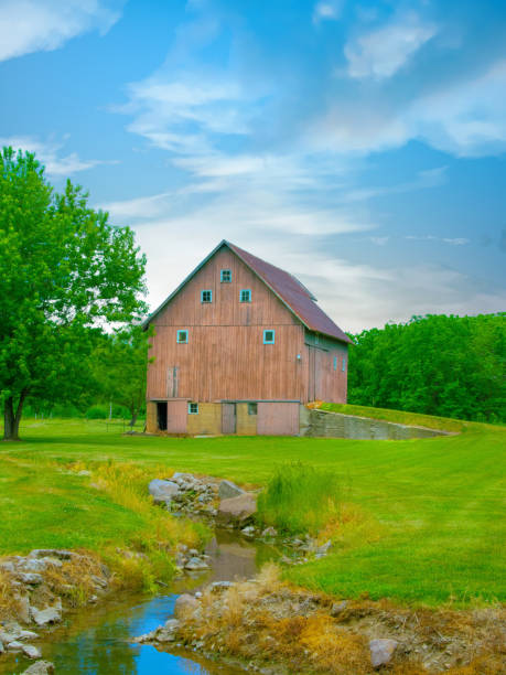 istock Old Weathered Barn with Small Stream-Miami County, Indiana 1580569649