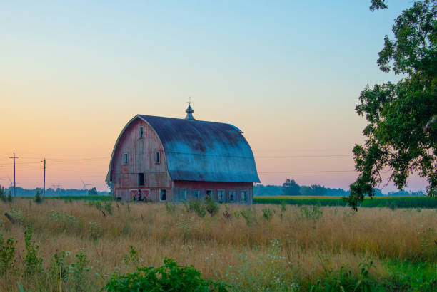 istock Old weathered Red Barn at sunrise-Howard County, Indiana 1580571267