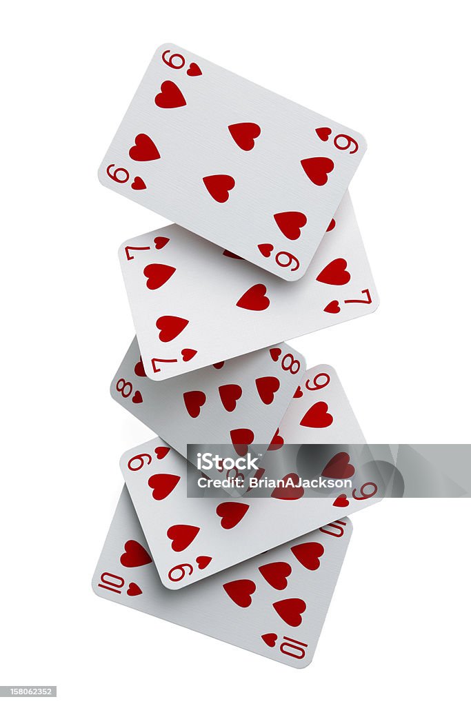 Straight flush cards falling Dealing a straight flush of cards falling to the ground Playing Card Stock Photo