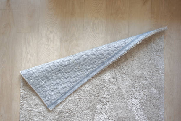 istock Seamless grey carpet texture background on wooden floor with copy space 1580638027