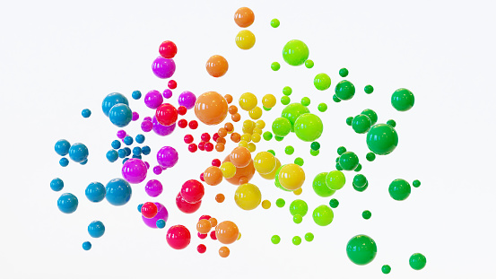 Cluster or cloud of colorful balls hover in the air. The balls are shiny and shows the rainbow colors.