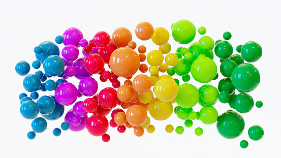 Cluster or cloud of colorful balls hover in the air. The balls are shiny and shows the rainbow colors.