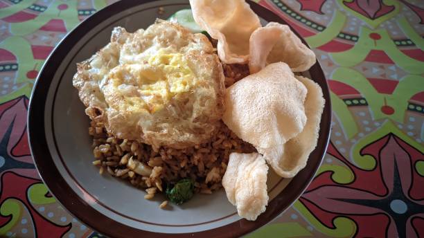 istock a plate of chicken fried rice with sunny side up eggs and crackers 1580723220