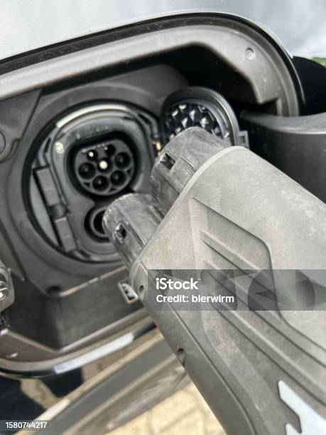 E Mobility Charging An Electrically Powered Vehicle Stock Photo - Download Image Now