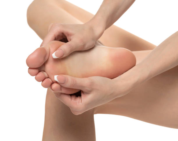 istock woman massaging her painful foot on white studio background 1580758919