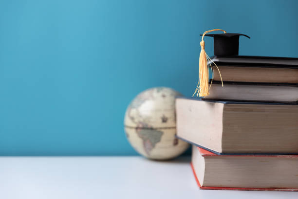 istock Graduation cap with Earth globe. Concept of global business study, abroad educational, Back to School, Study abroad business in universities. Elements of this image furnished by NASA. 1580761659