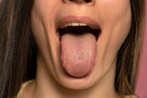 Front view of a woman tongue stock photo