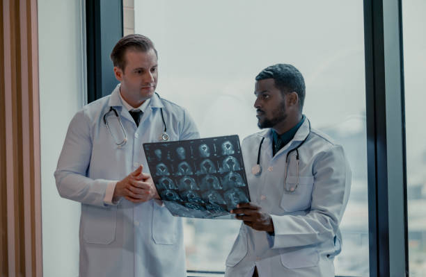 istock Doctors analyze MRI during breaks to plan treatment, procedures, and refer patients to specialists. 1580778981