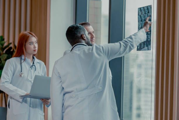 istock Doctors analyze MRI during breaks to plan treatment, procedures, and refer patients to specialists. 1580779204
