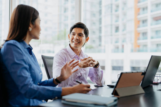 istock Malay business team having a discussion in office 1580779287