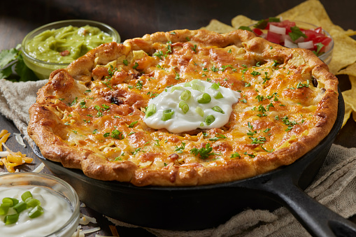 Deep Dish Cheesy Beef Taco Pie with Guacamole, Salsa and Sour Cream