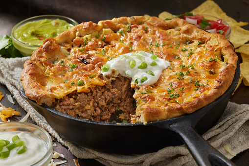 Deep Dish Cheesy Beef Taco Pie with Guacamole, Salsa and Sour Cream