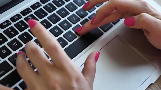 Woman typing on the keyboard