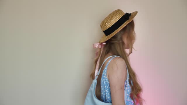 Blonde woman wearing blue bag, fashion doll style