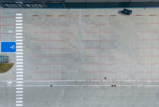 aerial drone view of empty parking for trucks and cars