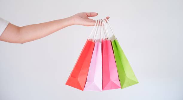 istock woman holding shopping bag 1580792197