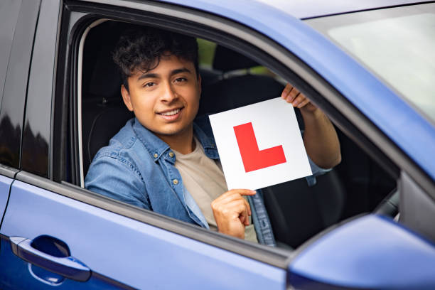 istock Young man learning to drive in England 1580816312