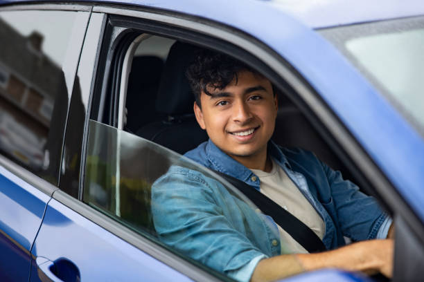 istock Young English man driving a car 1580816848