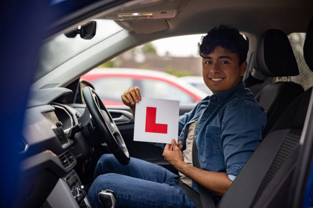 istock Young man learning to drive in England 1580816853