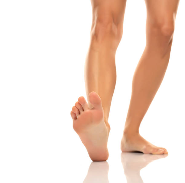 istock Nude barefoot female legs and soles 1580817427