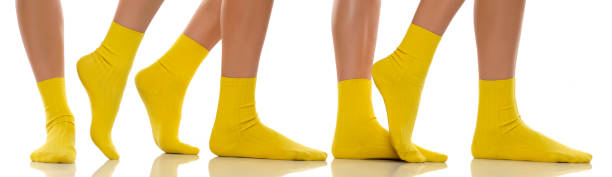 Collage of a pretty female feet in yellow short socks stock photo