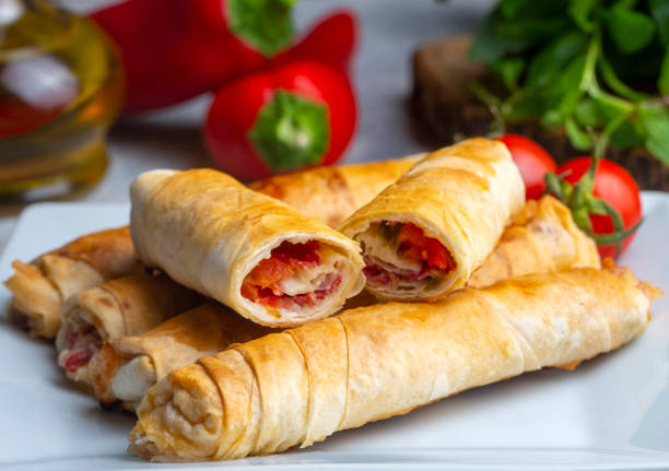 istock Turkish Pacanga Boregi with pastirma (pastrami) and cheddar (melted) cheese. - Pastirmali Borek 1580854963