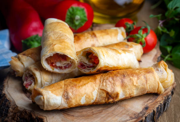 istock Turkish Pacanga Boregi with pastirma (pastrami) and cheddar (melted) cheese. - Pastirmali Borek 1580856635
