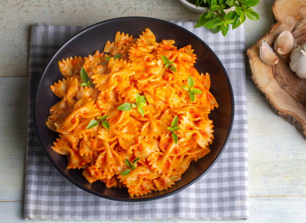 istock Farfalle pasta with tomato sauce, bow tie pasta tomatoes sauce (Turkish name; domatesli kelebek makarna) 1580860084