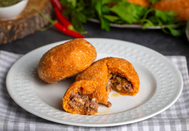 istock Kibbeh is a popular dish in Middle Eastern cuisine (Turkish name; icli kofte - Adana icli koftesi) 1580869953