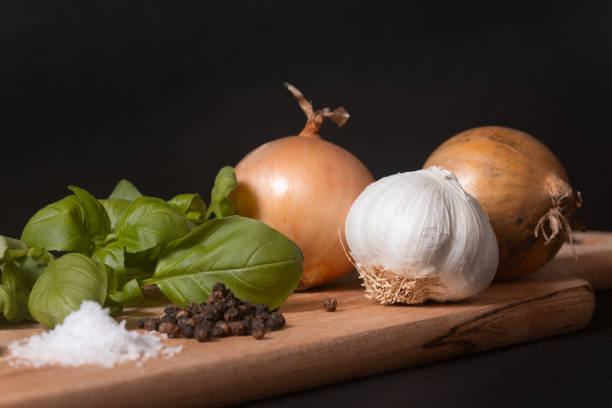 Onions, Garlic, Base, salt and pepper artisticly placed on a serving tray.