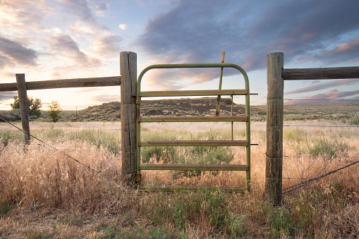 Gate to corral at sunset at the Pacific Lakes Recreation Site in Eastern Washington