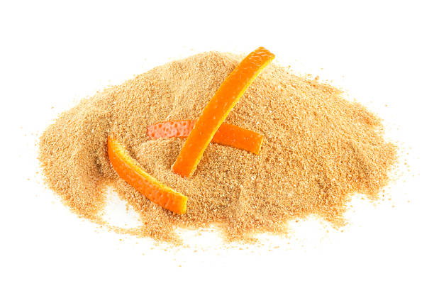 istock Ground dried orange peel and fresh orange peel isolated on a white background 1580915431